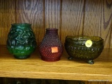 3 PIECE LOT; INCLUDES A 3 FOOTED DIAMOND PATTERN DISH, A RED CANDLE SHADE, AND A GREEN GLASS CANDLE