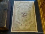 FLORAL AREA RUG; CREAM COLORED MACHINE MADE RUG WITH BLUE AND LIGHT YELLOW FLOWERS. MEASURES 3 FT X