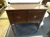 ANTIQUE FEDERAL STYLE SERVER; HAS 2 DOORS WITH OVAL BESSELS AND REEDED SHERATON STYLE LEGS. IS IN