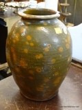 SALT GLAZED CROCK; GREEN AND ORANGE SALT GLAZED CROCK WITH A CHIP ON THE RIM. MEASURES 7 IN X 10 IN