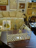 WROUGHT IRON WALL HANGING SHELF; HAS A FLORAL MOTIF AND LATTICE BOTTOM. MEASURES 20 IN X 9 IN X 28