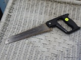 COMPASS SAW; HAND SAW WITH BLACK HANDLE AND PHILLIPS HEAD SCREWS HOLDING THE BLADE.