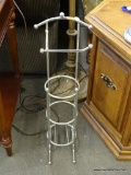 TOILET PAPER STAND; SILVER TOILET PAPER STAND WITH ARM FOR TOILET PAPER AND LOWER COMPARTMENT FOR