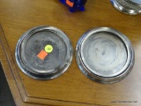 SILVER CANDLE PLATES; PAIR OF SILVER CANDLE PLATES. SMALLER PLATE MEASURES 5.5 IN DIAMETER AND