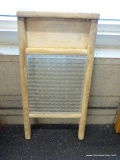 WASHBOARD; VINTAGE COLUMBUS WASHBOARD WITH WOODEN FRAME AND GLASS CENTER. MEASURES 18 IN TALL