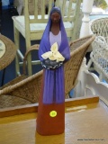 POTTERY SCULPTURE OF A WOMAN HOLDING LILY BLOSSOMS; POTTERY SCULPTURE OF WHAT APPEARS TO BE A NATIVE