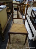 CANE SEAT CHAIR; POST BACK CHAIR WITH CANE SEAT. FRAME OF CHAIR BACK CONTAINS LIGHTLY COLORED AND