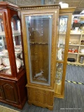 GLASS FRONT, WOOD FRAME GUN CABINET; STACKED DOOR WOODEN GUN CABINET. TOP DOOR CONTAINS A GLASS