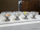 FOUR VINTAGE ETCHED GLASS SHERBET DISHES IN SILVER PLATE STANDS; TWO MATCHING PAIRS OF ETCHED GLASS