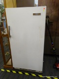 HOLIDAY UPRIGHT FREEZER; WHITE HOLIDAY FREEZER WITH WOOD PANEL HANDLE. CONTAINS 3 METAL WIRE SHELVES