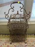 DECORATIVE STACKED IRON BASKETS; THIS UNIQUE PIECE FEATURES TWO IRON BASKETS WITH LATTICED BOTTOMS