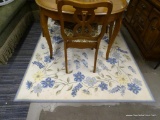BLUE AND YELLOW FLORAL AREA RUNNER; FEATURES LIGHT BLUE, DARK BLUE, AND YELLOW FLOWERS ON A VINE,