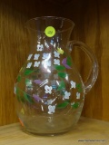 HAND PAINTED PITCHER; FEATURES WHITE, BLUE, RED, AND PURPLE FLOWERS ON A VINE THAT WRAPS AROUND THE