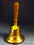 BRASS BELL; WOOD HANDLED BRASS BELL. MEASURES 7 IN.