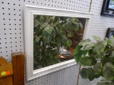WALL MIRROR; WALL MIRROR FRAMED IN A WHITE, BEVELED FRAME. MEASURES 23.5 IN X 19.5 IN.