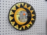 HAND PAINTED SUN MIRROR; FRAME OF MIRROR IS PAINTED IN ORANGE, YELLOW, BLACK, AND GOLD, AND HAS THE