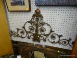 CAST IRON WALL DECORATION; TRIANGLE SHAPED WALL DECORATION FEATURING SCROLL DESIGNS WITH FLOWERS AND