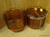 SET OF GLASS PLANTERS; 2 PIECE LOT OF AMBER GLASS PLANTERS. ONE COMES WITH COPPER TONED BAND WITH