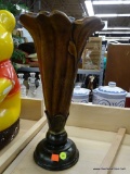 LARGE CARVED VASE; LARGE BROWN DECORATIVE VASE THAT LOOKS LIKE A BLOOMING FLOWER. LOOKS LIKE