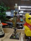 TALL TABLE LAMP; METAL CANDLESTICK STYLE BODY WITH BRASS TONE AND DARK COLORED VERTICAL STRIPED