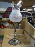 SILVER PLATE TABLE LAMP; HAS A FROSTED GLASS GLOBE AND MEASURES 17 IN TALL