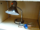 DESK LAMP; STAINLESS STEEL DESK LAMP WITH ADJUSTABLE HEAD. MEASURES 14 IN FULLY EXTENDED.
