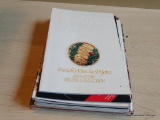 PARTIAL SHELF LOT OF VINTAGE COOKBOOKS; THIS LOT CONTAINS 17 PAPERBACK COOKBOOKS FROM A VARIETY OF