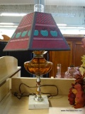 APPLE HURRICANE TABLE LAMP; THIS MARBLE BASE TABLE LAMP FEATURES A SILVER BODY, WITH AN AMBER