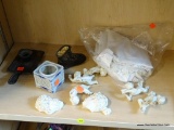 ASSORTED LOT; INCLUDES AN ANTIQUE BABY BOOT, A CAST IRON CANDLE STICK HOLDER, A PAIR OF MAN AND