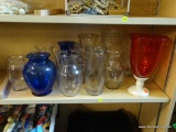 LARGE LOT OF VASES; SOME ARE CLEAR, SOME ARE COBALT BLUE, SOME ARE CRANBERRY COLORED, AND SOME ARE