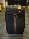 LONDON FOG SUITCASE; BLACK WITH BROWN TRIM AND ORIGINAL LONDON FOG TAG. IS IN GOOD USED CONDITION!