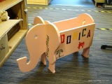 PINK ELEPHANT SHAPED TOY BOX; THIS LOT IS A PAINTED WOODEN PINK ELEPHANT TOY BOX. IT HAS AN OPEN