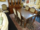 DINING ROOM SET; INCLUDES A TABLE AND 6 CHAIRS. TABLE HAS A 3 IN BANDED TOP WITH SHERATON STYLE LEGS