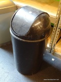 BLACK TRASH CAN; BLACK TRASH CAN WITH REVOLVING TOP LID. MEASURES 26 IN TALL
