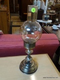 CANDLE STICK HOLDER; METAL CANDLESTICK HOLDER WITH GLASS SHADE. MEASURES 16 IN TALL