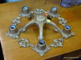 VINTAGE LIGHT FIXTURE; HAS 5 LIGHT HOLDING CAPABILITIES AND IS FLUSH MOUNTED. HAS SCROLLING DETAILS
