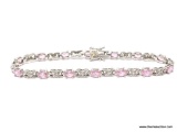 LADIES .925 STERLING SILVER 7 CT. PINK ICE TENNIS BRACELET. MEASURES 7-1/2 IN. WEIGHS 12.3 GRAMS.