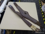 TWO USED 44 IN SHAPED LEATHER GIRTHS; TWO TWO-TONED BROWN LEATHER GIRTHS. ONE IS MADE BY TENKA