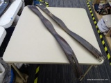 TWO SHAPED LEATHER GIRTHS; TWO DARK BROWN COLORED GIRTHS. 1 READS 52 IN BUT MEASURES 54 IN FROM