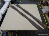 TWO SHAPED LEATHER GIRTHS; TWO DARK BROWN COLORED GIRTHS. BOTH READ 42 IN BUT MEASURES 51 IN FROM