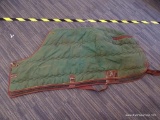 WINTER TIME HORSE BLANKET; IS GREEN AND BROWN IN COLOR. IS IN GOOD CONDITION. MEASURES 66 IN