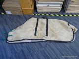 SIMCO STABLE BLANKET; KHAKI AND BLACK STABLE BLANKET WITH GREEN STRAPS. HAS MINOR RIPPING AND NEEDS