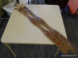 TWO USED 52 IN SHAPED LEATHER GIRTHS; TWO COGNAC COLORED GIRTHS. READ 50 IN BUT MEASURE 52 IN FROM