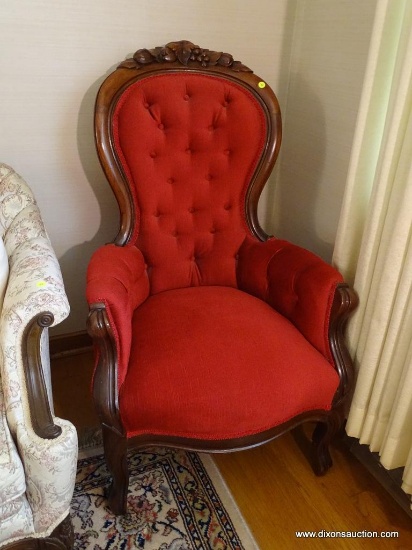 (LR) VICTORIAN GENTLEMAN'S CHAIR; HAS FLORAL AND FRUIT CARVED CREST AND RED UPHOLSTERY. MEASURES 25