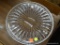 ROUND VINTAGE FOOTED CAKE STAND; CLEAR GLASS WITH ETCHED DESIGN. MEASURES 12 IN X 1.5 IN.