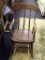 VINTAGE WOODEN ROCKING CHAIR; FEATURES DECORATIVE SPINDLES & CURVED ARM RESTS. MEASURES 13.5 IN X 23