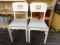 PAIR OF WHITE WOODEN CHAIRS; FEATURE A WHITE PAINTED FRAME AND TEXTURED LIGHT BLUE UPHOLSTERY.