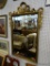 GOLD PAINTED WALL MIRROR; BEVELED GLASS MIRROR IN A GOLD, BEVELED WOOD FRAME THAT FEATURES A