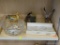 PARTIAL SHELF LOT OF HOUSEHOLD DECOR; INCLUDES DUCK FIGURINES, A CANDLE THAT RESEMBLES A STUMP, A