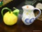 JUICE PITCHERS; INCLUDES A LEMON SHAPED PITCHER WITH A VINE STEM AND A LEAF SPOUT, AND A WHITE